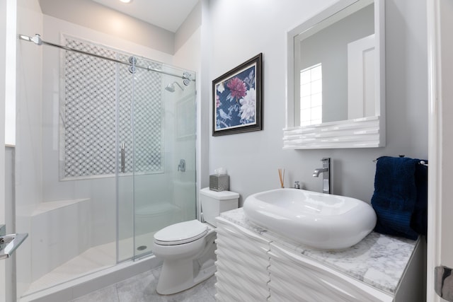 157 Esperanza Way, Palm Beach Gardens, FL 33418 - bathroom featuring a stall shower, toilet, vanity, and tile patterned floors
