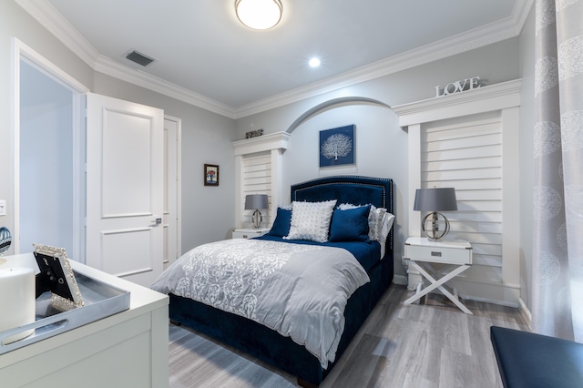 157 Esperanza Way, Palm Beach Gardens, FL 33418 - bedroom featuring light wood-style flooring and ornamental molding