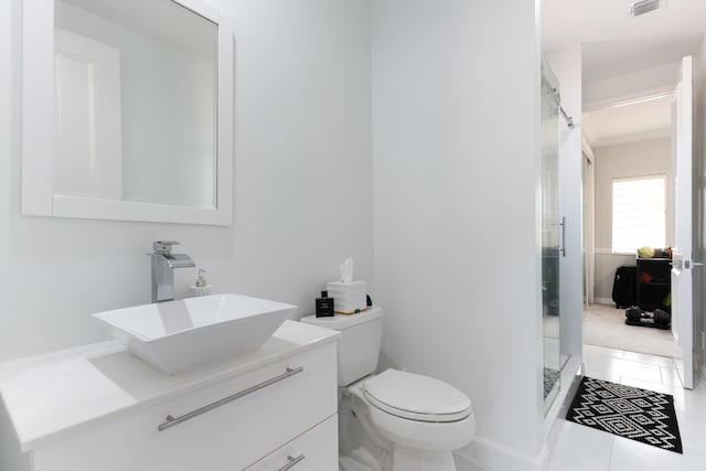 157 Esperanza Way, Palm Beach Gardens, FL 33418 - bathroom with vanity, a shower stall, toilet, ornamental molding, and tile patterned flooring