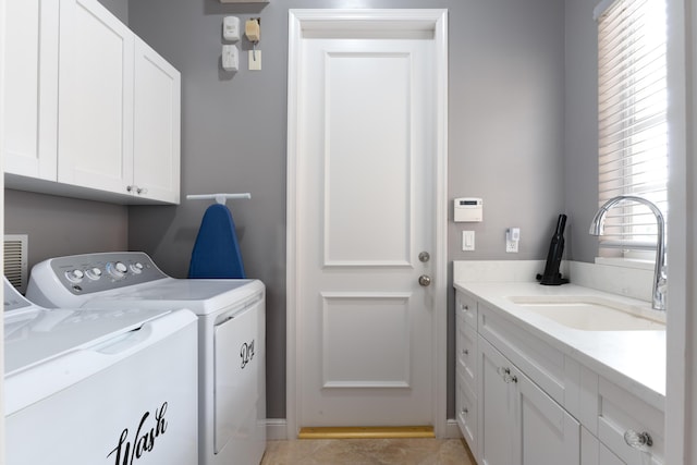 157 Esperanza Way, Palm Beach Gardens, FL 33418 - laundry area featuring washer and clothes dryer and cabinet space