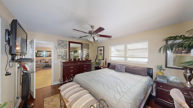bedroom with wood finished floors and a ceiling fan