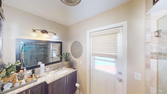 bathroom with a stall shower and vanity