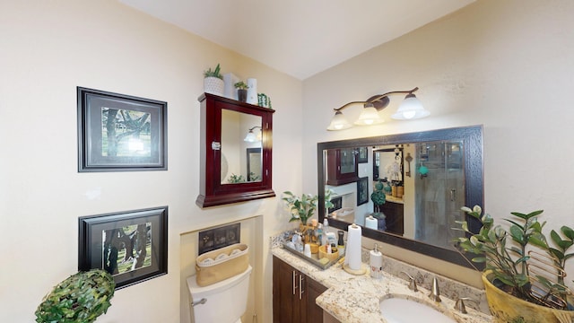 full bath with toilet, a shower stall, and vanity