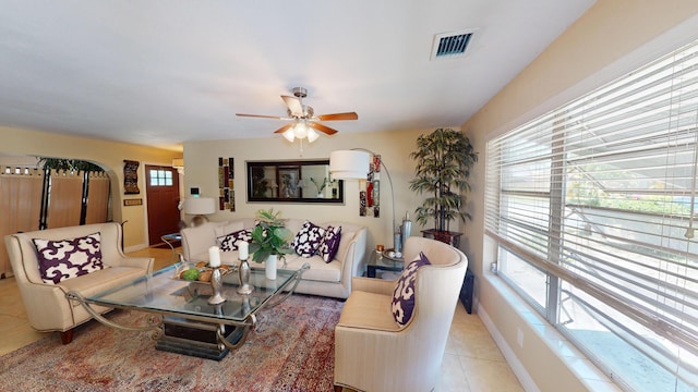 1630 40th St, West Palm Beach, FL 33407 - living room featuring light tile patterned flooring, ceiling fan, and baseboards