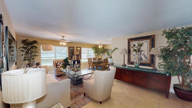 living room with ceiling fan and light tile patterned floors