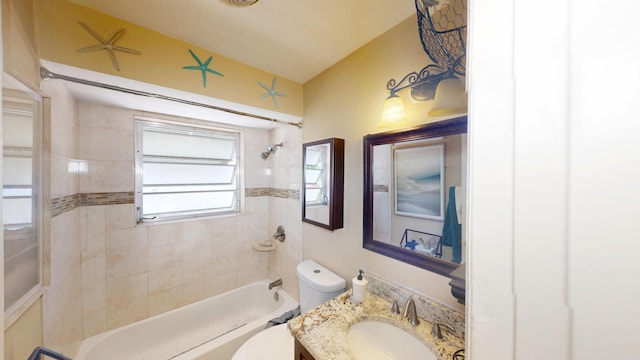 bathroom featuring toilet, washtub / shower combination, and vanity