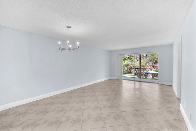 8826 W Mcnab Rd Unit 201, Tamarac, FL 33321 - unfurnished room featuring a chandelier, a textured ceiling, light tile patterned flooring, and baseboards