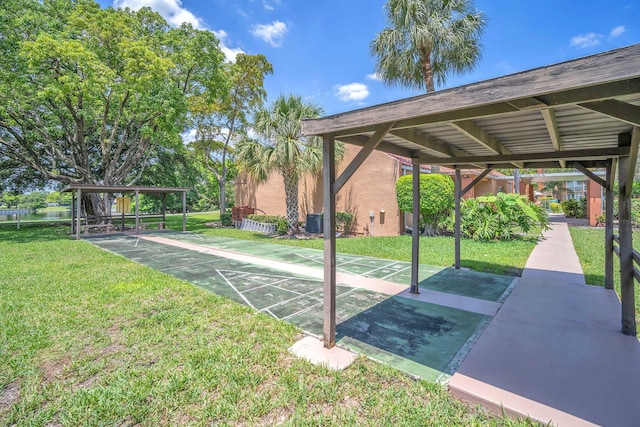 8826 W Mcnab Rd Unit 201, Tamarac, FL 33321 - view of community with a lawn, shuffleboard, and a water view