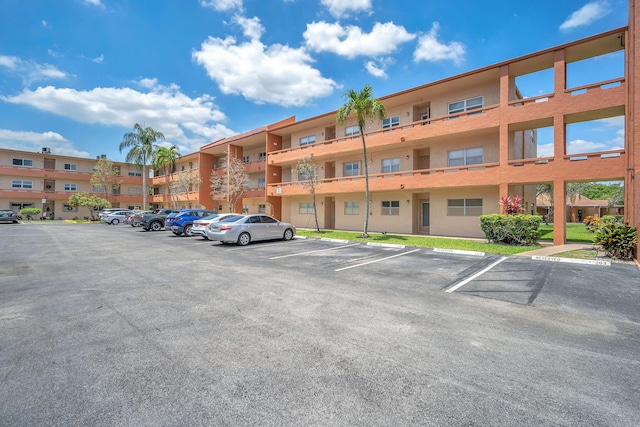 8826 W Mcnab Rd Unit 201, Tamarac, FL 33321 - view of apartment building / complex featuring uncovered parking