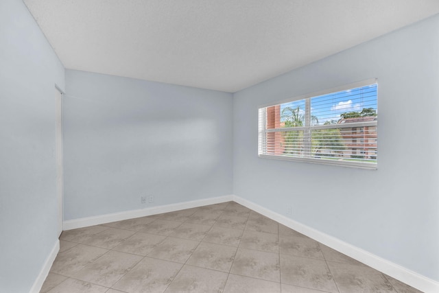 8826 W Mcnab Rd Unit 201, Tamarac, FL 33321 - unfurnished room featuring tile patterned floors and baseboards