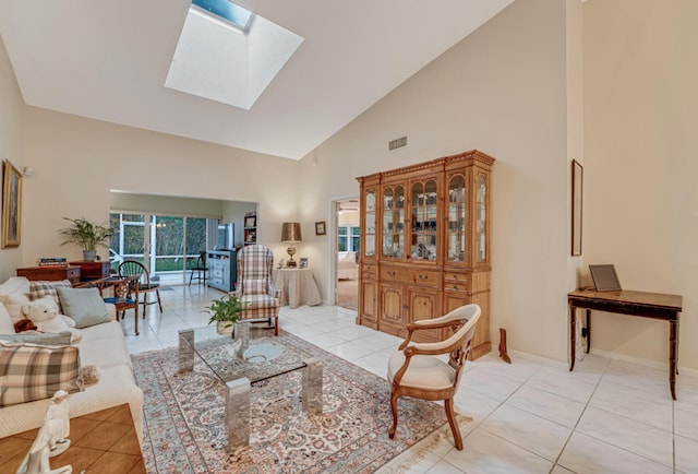 7043 Summer Tree Dr, Boynton Beach, FL 33437 - living area featuring high vaulted ceiling, light tile patterned floors, a skylight, and baseboards