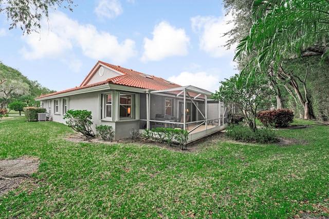 7043 Summer Tree Dr, Boynton Beach, FL 33437 - rear view of property featuring a tile roof, stucco siding, and a yard
