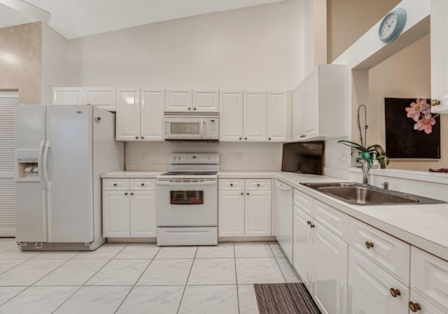 7043 Summer Tree Dr, Boynton Beach, FL 33437 - kitchen featuring white appliances, light countertops, white cabinetry, and light marble finish flooring