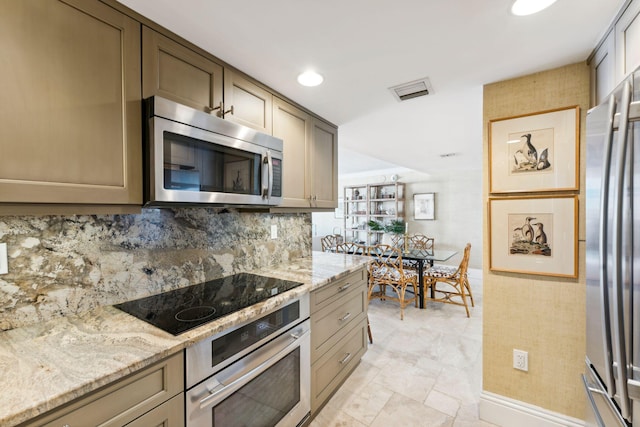 1200 S Flagler Dr Unit 1402, West Palm Beach, FL 33401 - kitchen with appliances with stainless steel finishes, light stone counters, tasteful backsplash, and recessed lighting