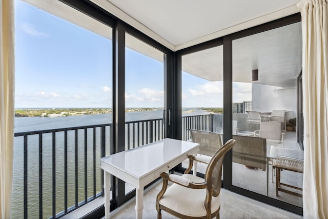 1200 S Flagler Dr Unit 1402, West Palm Beach, FL 33401 - sunroom featuring a water view, healthy amount of natural light, and floor to ceiling windows