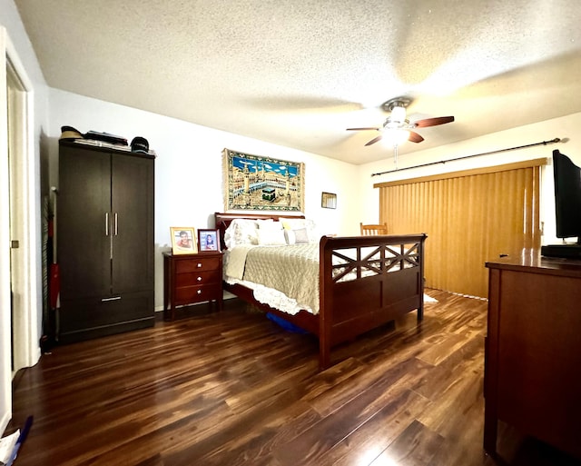 bedroom featuring wood finished floors, a textured ceiling, and ceiling fan