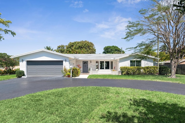 1101 SE 7th Ct, Deerfield Beach, FL 33441 - ranch-style house with a garage and asphalt driveway