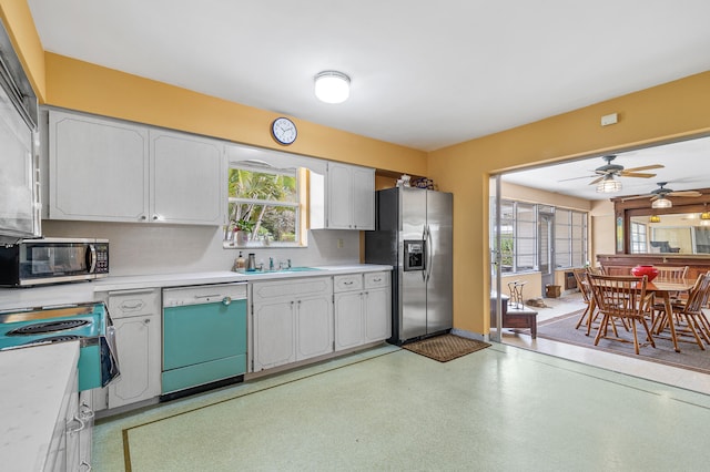 1101 SE 7th Ct, Deerfield Beach, FL 33441 - kitchen featuring appliances with stainless steel finishes, light countertops, ceiling fan, and a sink
