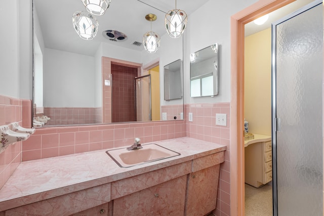 1101 SE 7th Ct, Deerfield Beach, FL 33441 - full bathroom featuring tile walls, a stall shower, vanity, and wainscoting