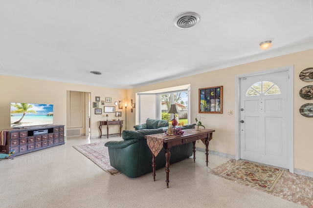 1101 SE 7th Ct, Deerfield Beach, FL 33441 - living room with healthy amount of natural light, speckled floor, and baseboards