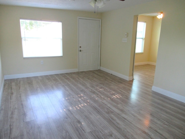 5310 Palm Dr, Fort Pierce, FL 34982 - spare room featuring ceiling fan, wood finished floors, and baseboards