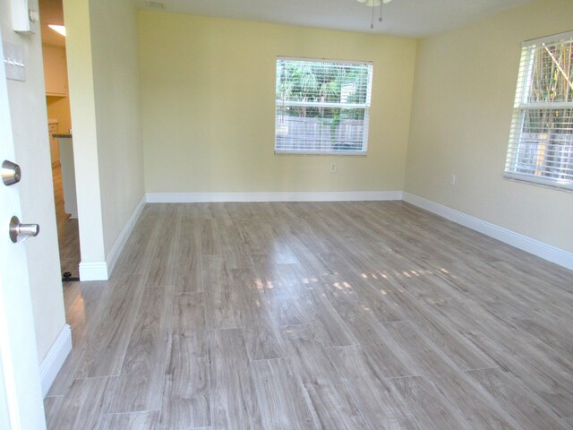 5310 Palm Dr, Fort Pierce, FL 34982 - unfurnished room with wood finished floors and baseboards