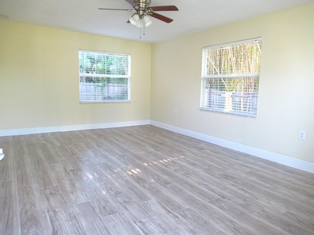 5310 Palm Dr, Fort Pierce, FL 34982 - spare room featuring a ceiling fan, wood finished floors, and baseboards