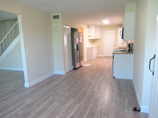 5310 Palm Dr, Fort Pierce, FL 34982 - kitchen with a sink, stainless steel appliances, light wood finished floors, and baseboards