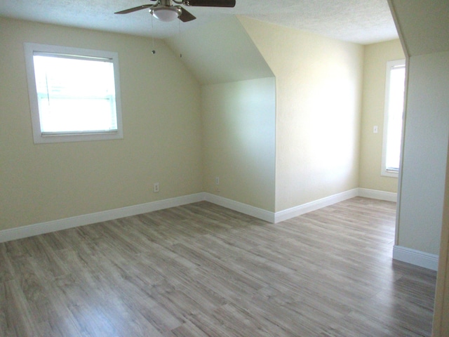 5310 Palm Dr, Fort Pierce, FL 34982 - bonus room featuring a ceiling fan, wood finished floors, lofted ceiling, and baseboards