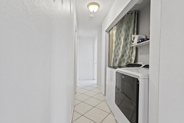 2008 SE Triumph Rd, Port Saint Lucie, FL 34952 - laundry area with washer and dryer and light tile patterned floors