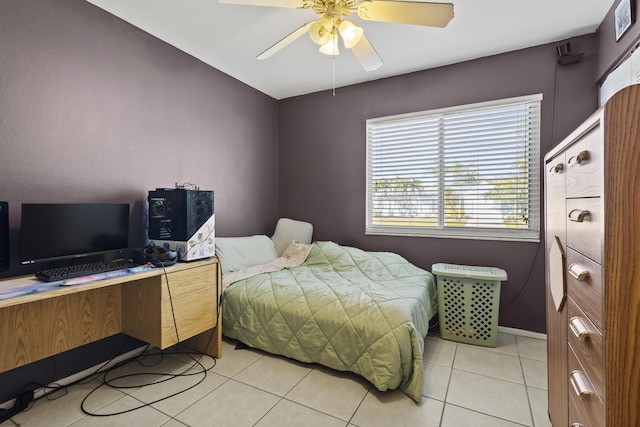 2008 SE Triumph Rd, Port Saint Lucie, FL 34952 - bedroom with light tile patterned floors, ceiling fan, and baseboards