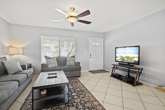 2008 SE Triumph Rd, Port Saint Lucie, FL 34952 - living area featuring ceiling fan, light tile patterned floors, and baseboards