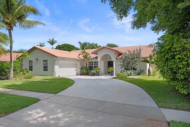 1341 SW 17th St, Boca Raton, FL 33486 - mediterranean / spanish-style house with stucco siding, a tile roof, and an attached garage