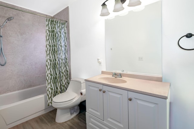 bathroom featuring toilet, shower / bath combination with curtain, vanity, and wood finished floors