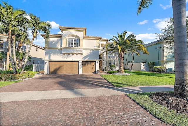 9606 Shepard Pl, Wellington, FL 33414 - mediterranean / spanish house with decorative driveway, a garage, and stucco siding