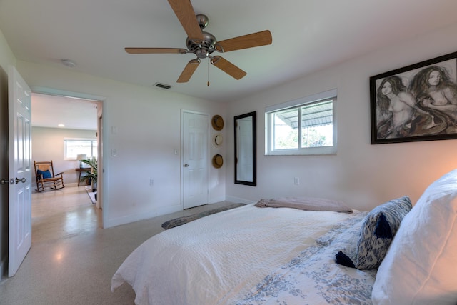 bedroom featuring multiple windows, ceiling fan, and baseboards