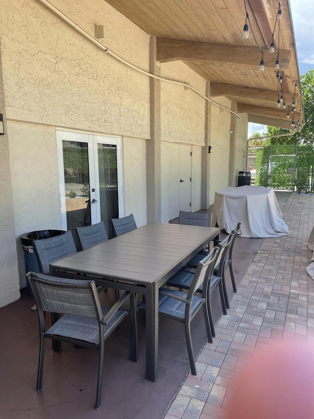 view of patio featuring french doors and outdoor dining area
