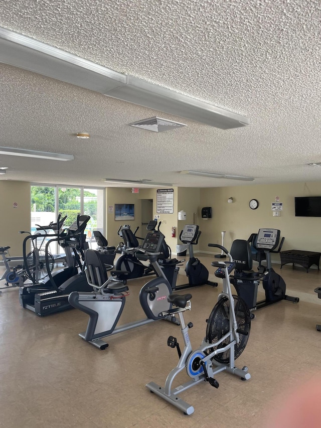 workout area with a textured ceiling