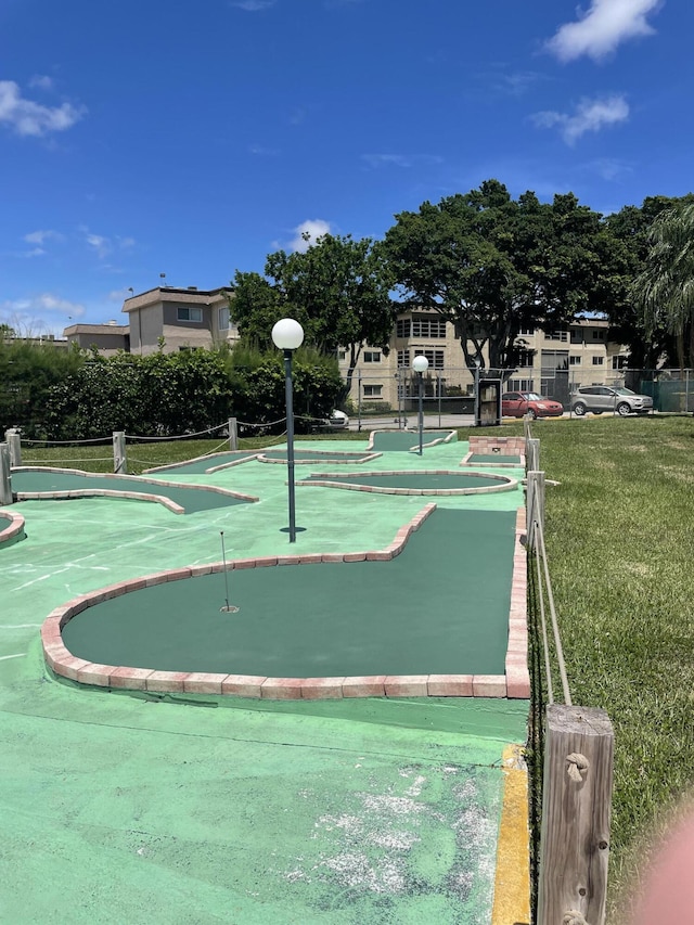 view of property's community with an area to practice putting