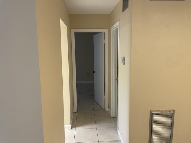 hallway featuring light tile patterned floors