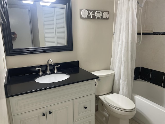 bathroom featuring toilet, vanity, and shower / bath combination with curtain