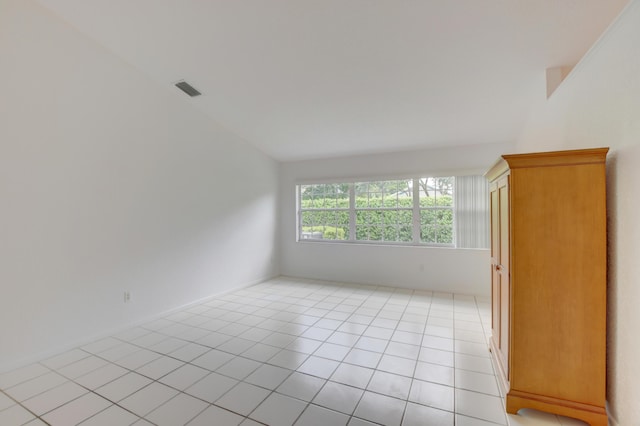 17215 Boca Club Blvd Unit 2, Boca Raton, FL 33487 - unfurnished room featuring vaulted ceiling and light tile patterned floors