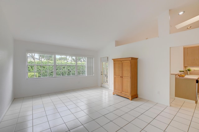 17215 Boca Club Blvd Unit 2, Boca Raton, FL 33487 - spare room with high vaulted ceiling and light tile patterned floors