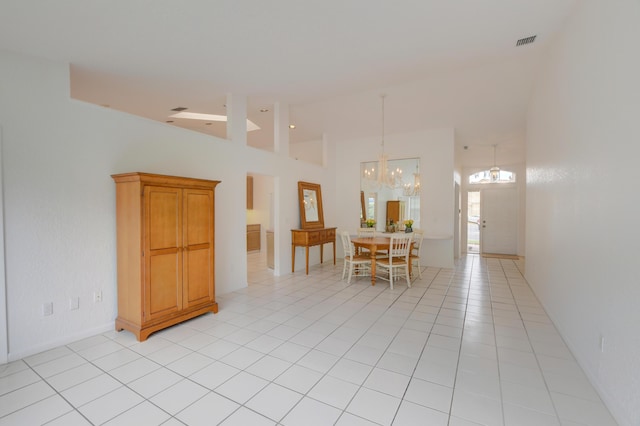17215 Boca Club Blvd Unit 2, Boca Raton, FL 33487 - dining room featuring a chandelier, high vaulted ceiling, and light tile patterned flooring