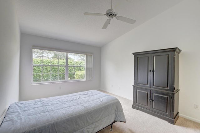 17215 Boca Club Blvd Unit 2, Boca Raton, FL 33487 - bedroom with light colored carpet, vaulted ceiling, baseboards, a ceiling fan, and a textured ceiling