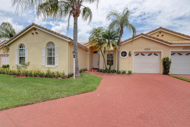 17215 Boca Club Blvd Unit 2, Boca Raton, FL 33487 - mediterranean / spanish home with driveway, stucco siding, a garage, and a front yard
