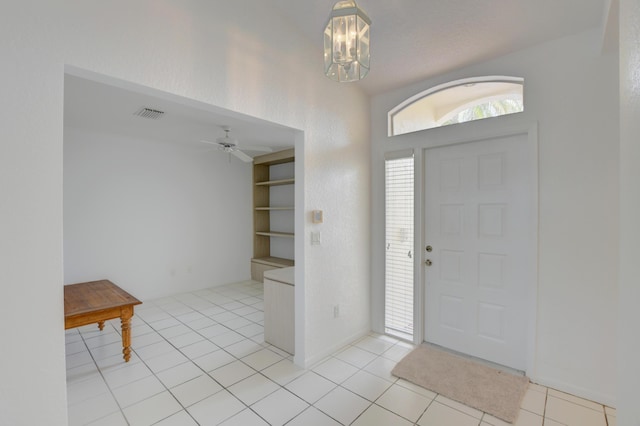 17215 Boca Club Blvd Unit 2, Boca Raton, FL 33487 - entrance foyer with a chandelier, light tile patterned floors, and ceiling fan