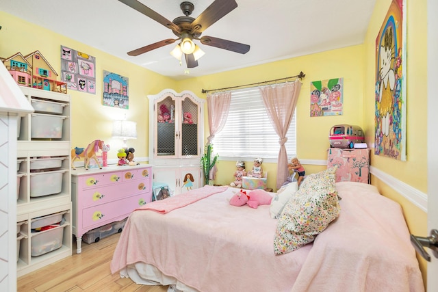 bedroom with wood finished floors and ceiling fan