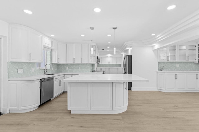 2611 NE 49th St, Lighthouse Point, FL 33064 - kitchen with appliances with stainless steel finishes, a sink, white cabinets, glass insert cabinets, and recessed lighting