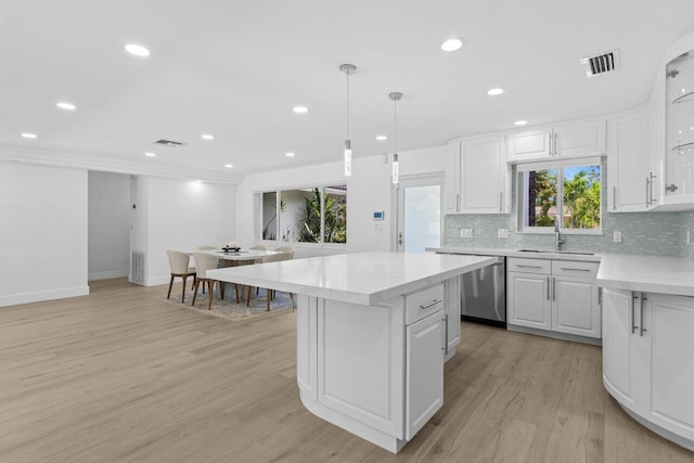 2611 NE 49th St, Lighthouse Point, FL 33064 - kitchen with a sink, a center island, light wood-type flooring, backsplash, and recessed lighting